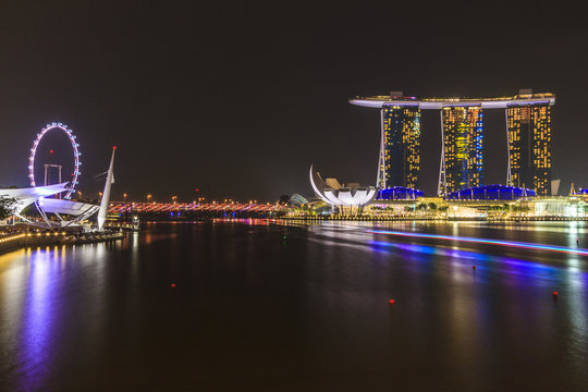 Marina Bay Sands Singapore and Singapore flyer at night time