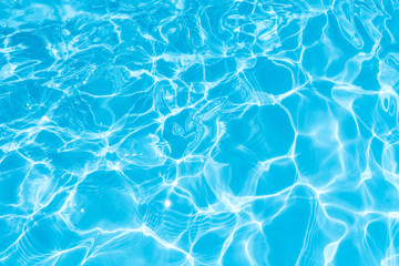 Ripple Water in swimming pool witn sun reflection