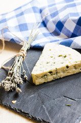 Blue cheese on rustic background