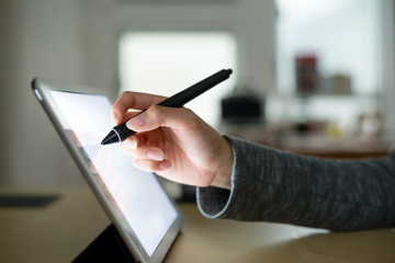 Woman write on digital tablet pc