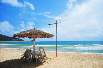 The beach with Palapa hut beach sun roof and chairs nearby airpo