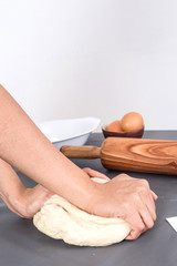 Female hands baking dough