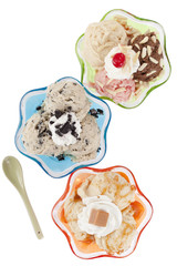 top view of three ice cream cups and spoon