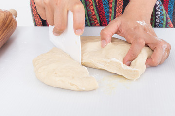 Female hands baking dough
