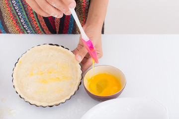 Female hands baking dough