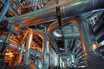 Equipment, cables and piping as found inside of a modern industrial power plant
