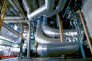 Equipment, cables and piping as found inside of a modern industrial power plant
