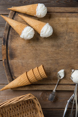 Fototapeta na wymiar creamy vanilla ice cream in preparation with rustic background