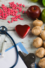 healthcare concept balance between medicine and healthy foods