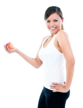 Happy Young Fitness Woman Presenting An Apple