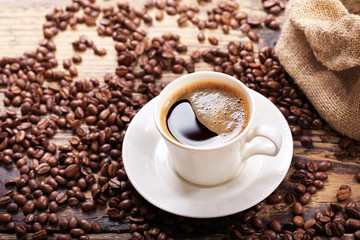 cup of coffee with beans