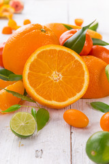 Fresh oranges on a wooden table.