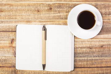 Blank notepad and coffee