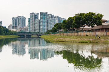 typical Singapore highrise public housing estate with river in f