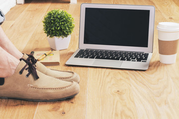Male feet laptop