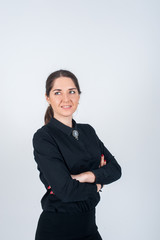 Business woman standing sideways simply in black shirt and smiling