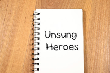 Unsung heroes write on notebook - 109492356