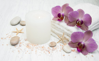 Candle, orcids and towels