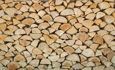 the chopped firewoods are neatly put, supply of firewoods on a w
