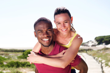 Cheerful young couple enjoying summer