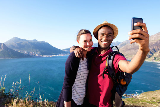 Loving young couple on holiday taking selfie