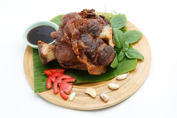 Deep Fried Pork Knuckle serve with vegetable and sauce