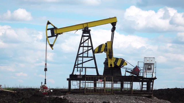 Working Oil Pump at blue sky time lapse 4k video
