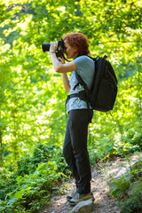 Tourist with backpack and camera