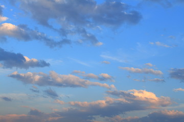 Blue, beautiful sky with  orange, grey clouds