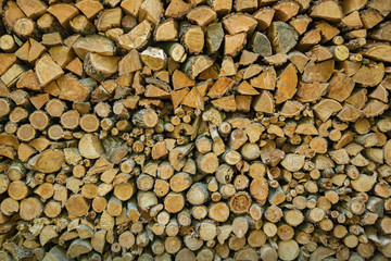 the chopped firewoods are neatly put, supply of firewoods on a w