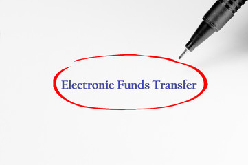 Electronic Funds Transfer on white paper - Business Concept