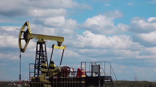 Working Oil Pump at blue sky zoom in Full hd video
