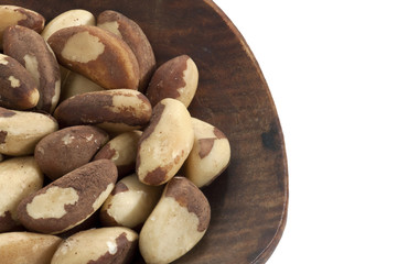 peeled almonds on a wooden bowl