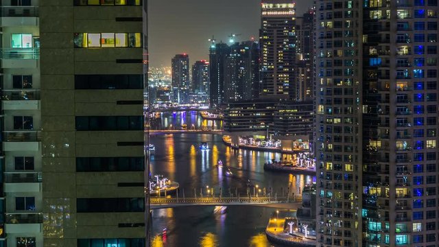 Beautiful aerial top view at night timelapse of Dubai Marina in Dubai, UAE