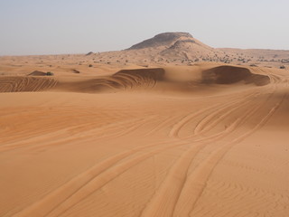 Fototapeta na wymiar Tracks of offroad driving in desert near Dubai