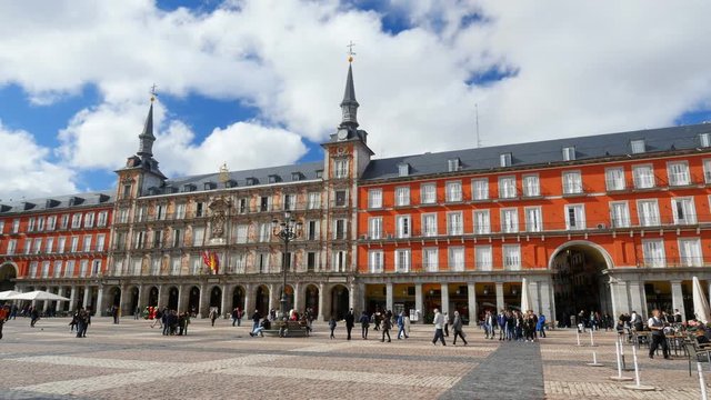 Tourists visit famous place Plaza Mayor. Madrid, Spain