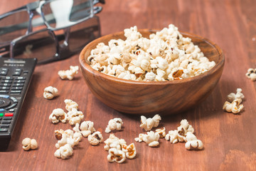 Popcorn, remote control and 3D glasses