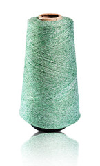 Spool of green shiny thread, isolated with a clipping path.