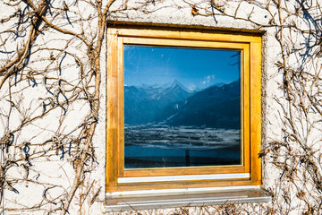 Window with mountain reflection