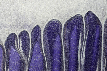 Dripping white, blue paint on purple  metal surface 1