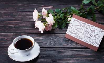 Fresh rose on wooden boards.
