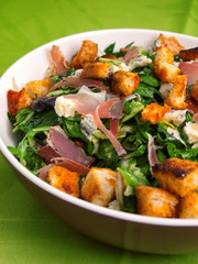 French Provencal Salad with green salad, bacon, croutons and blue cheese. Vertical shot