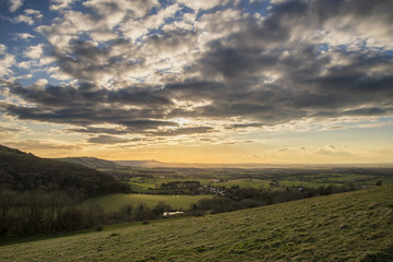 Beautiful landscape image of sunset over countryside landscape i