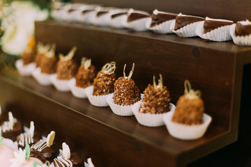 Vintage elegant delicious dessert table with stylish tableware