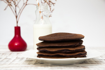 Chocolate pancake on a light background