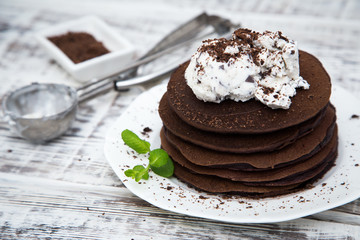 Chocolate pancake with icecream on a light background