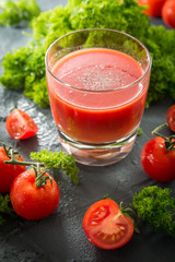 fresh organic tomatoes and tomato juice with parsley. the detox