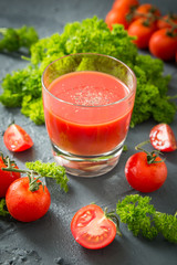 fresh organic tomatoes and tomato juice with parsley. the detox