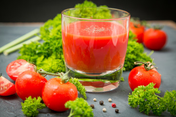 fresh organic tomatoes and tomato juice with parsley. the detox