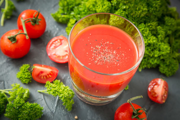 fresh organic tomatoes and tomato juice with parsley. the detox